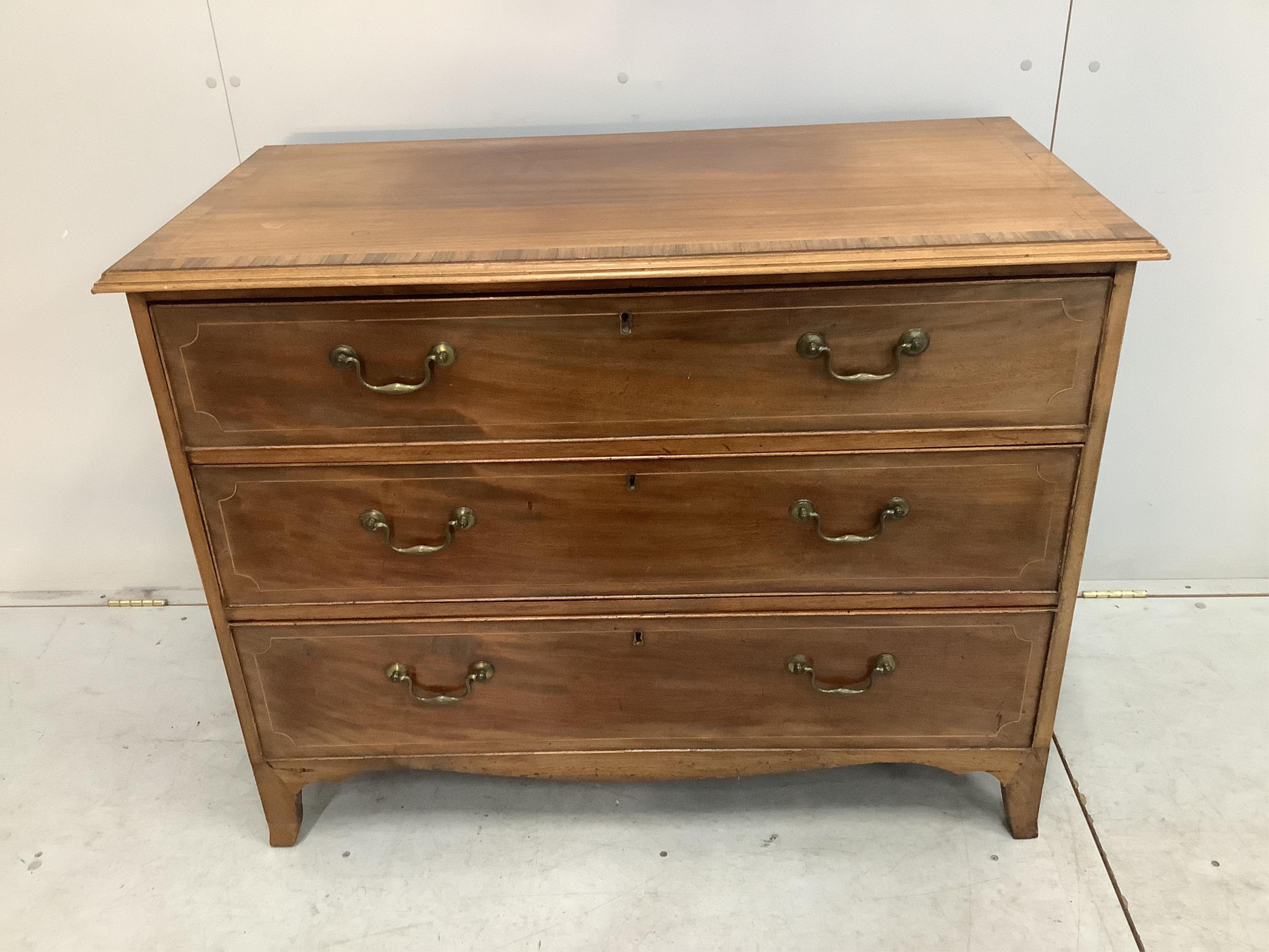 A George III rosewood banded mahogany three drawer chest, width 108cm, depth 55cm, height 84cm. Condition - fair